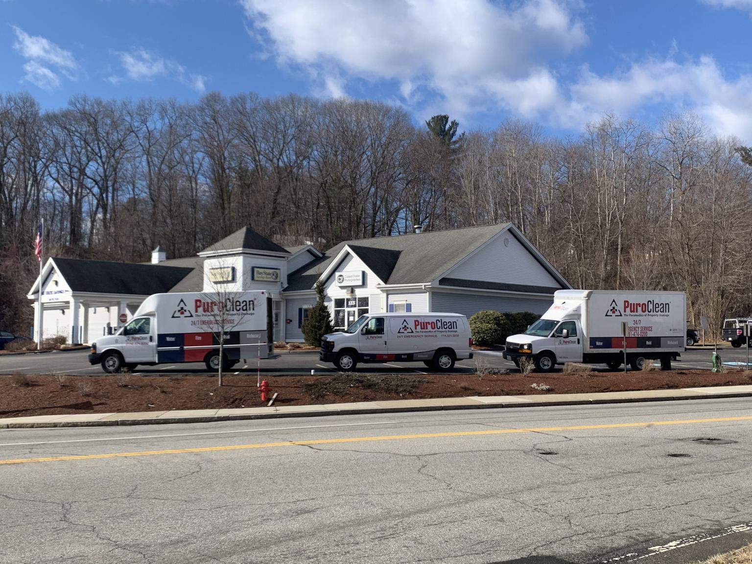 PuroClean trucks outside a location being serviced for damage restoration