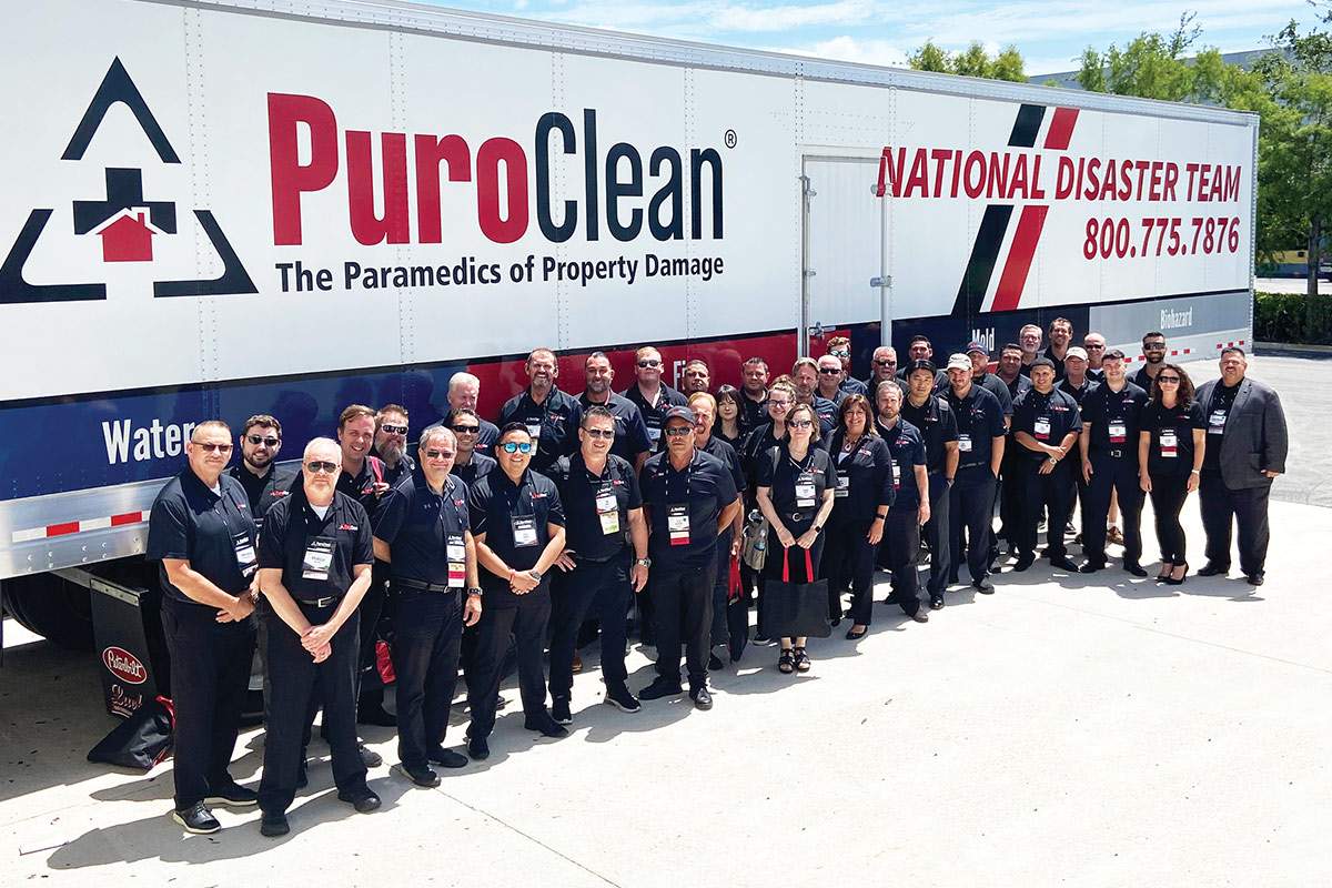 PuroClean team in front of company truck