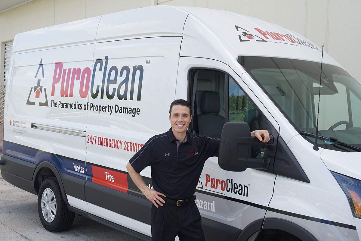 PuroClean franchisee on a company van