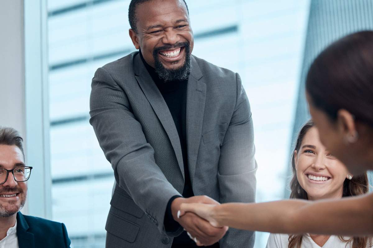 Business man shakes hands with colleagues