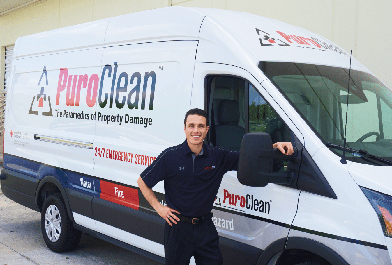 PuroClean Franchise owner in front of his van
