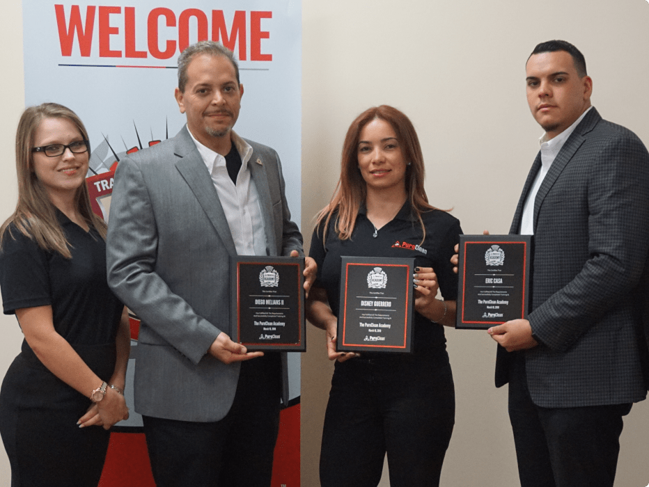 PuroClean owners holding awards