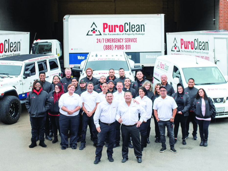 Various PuroClean team members and vehicles