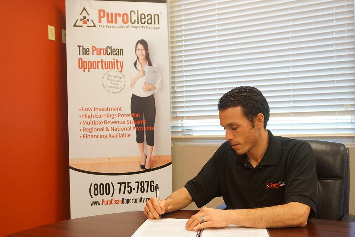 PuroClean employee at a desk