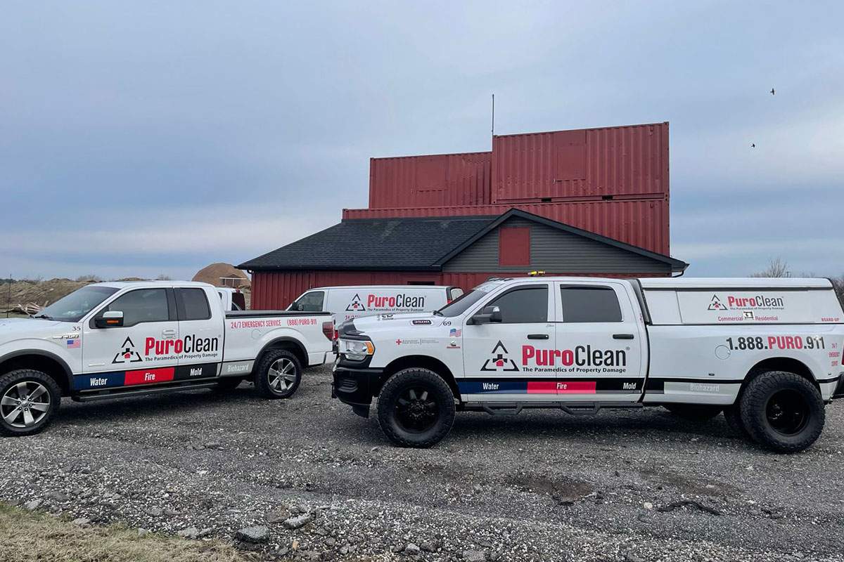 PuroClean trucks at a job site