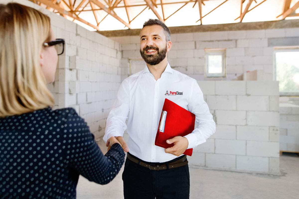 man shaking a woman's hand