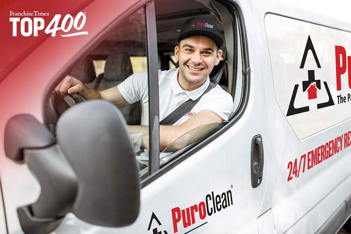 PuroClean employee in a company van