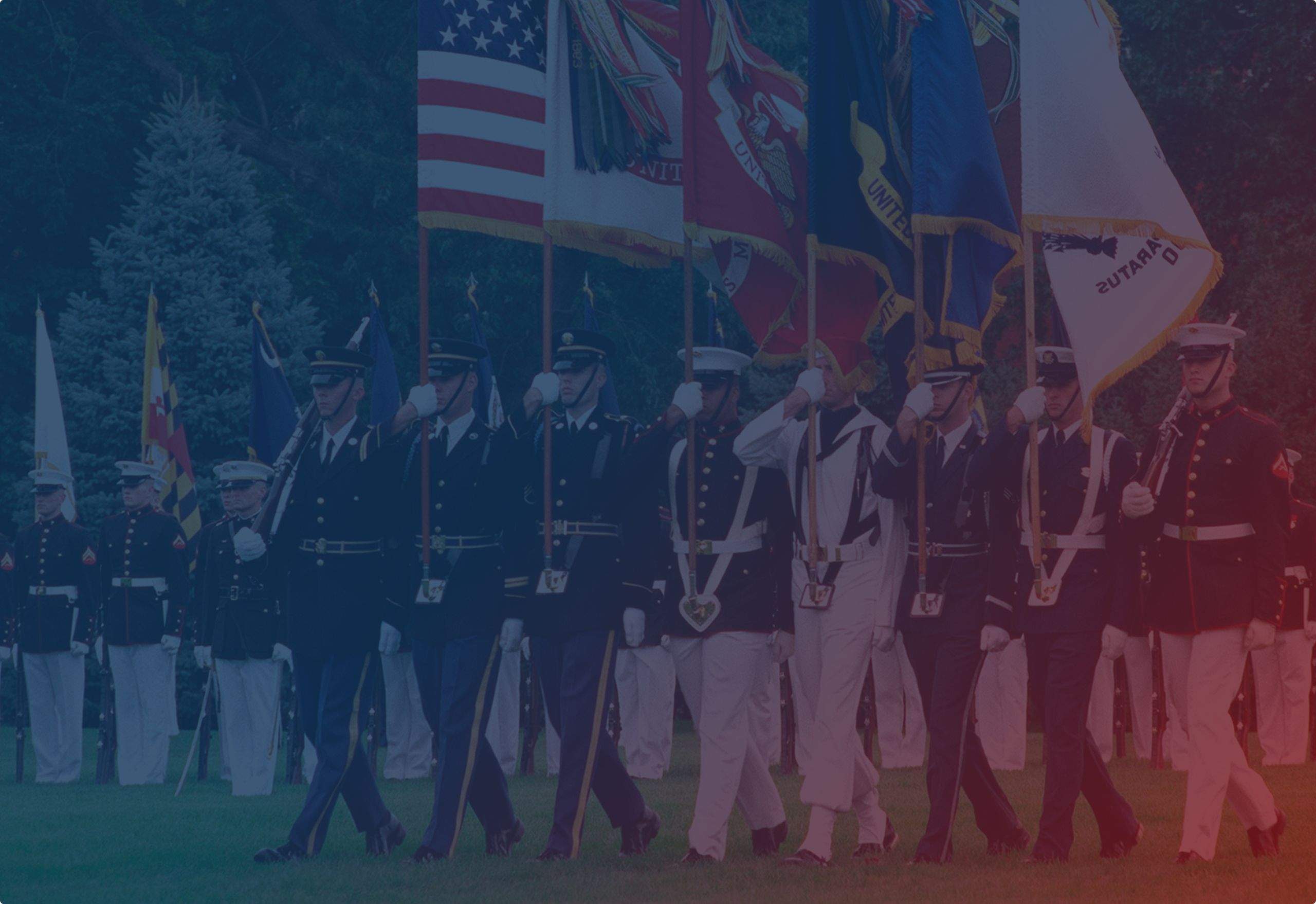 Service members carrying flags