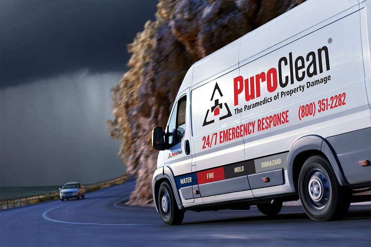 PuroClean van on the road