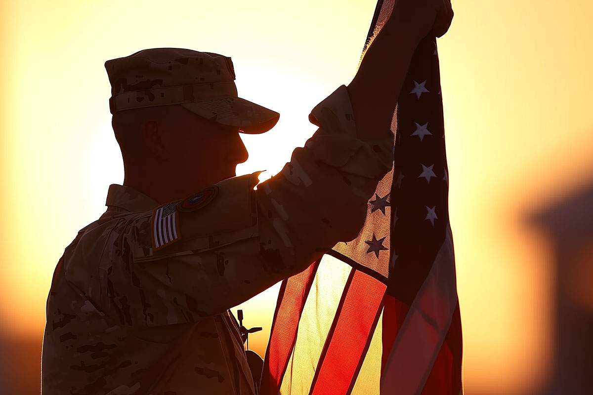 A solider holding a United States flag