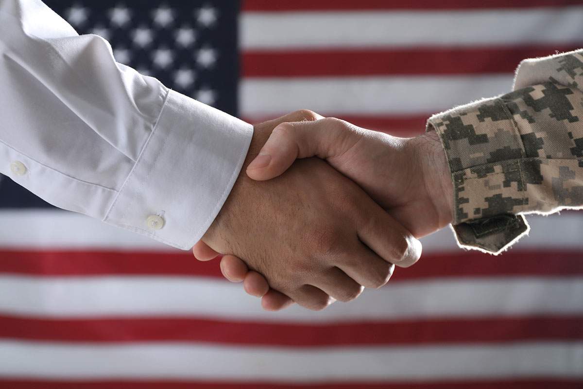 Veteran and businessman shaking hands
