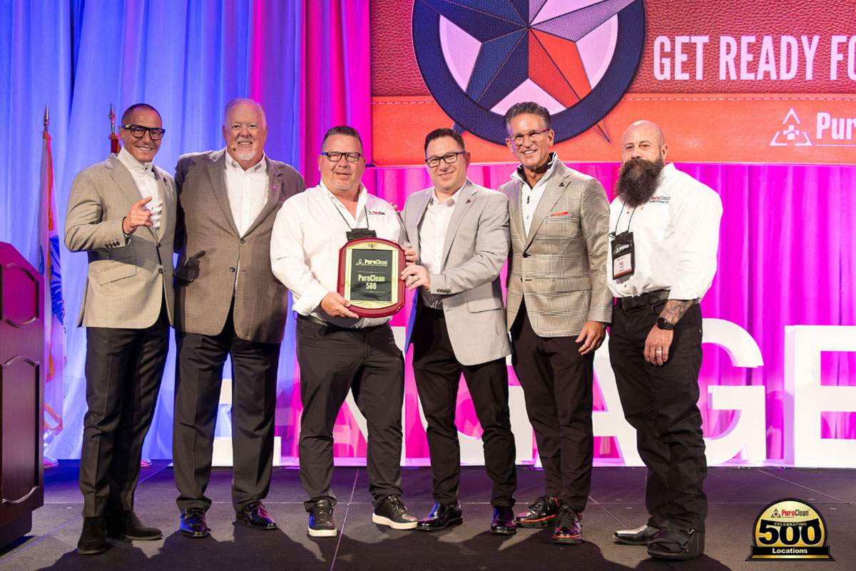 Keegan Trudgen and Tim Lohse signed their 12th franchise agreement and became owners of PuroClean's 500th franchise unit, highlighting the company's franchise business model.