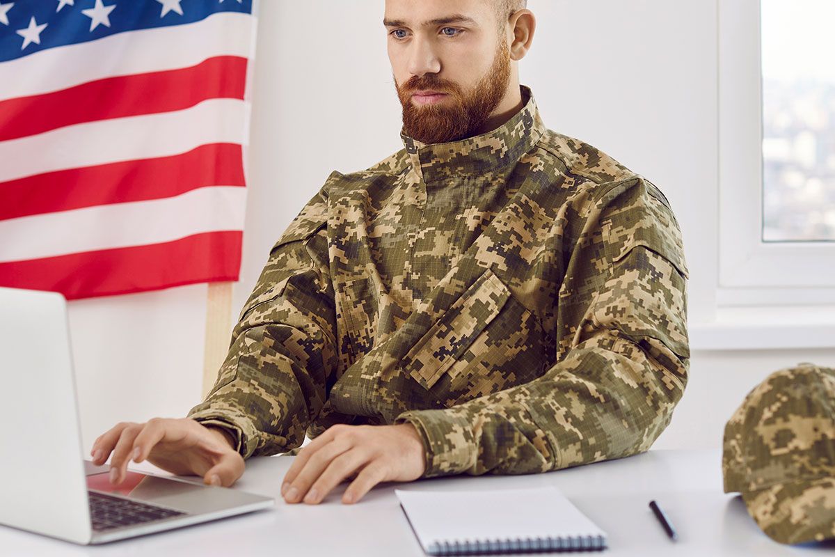 veteran franchise owner managing the business in front of laptop